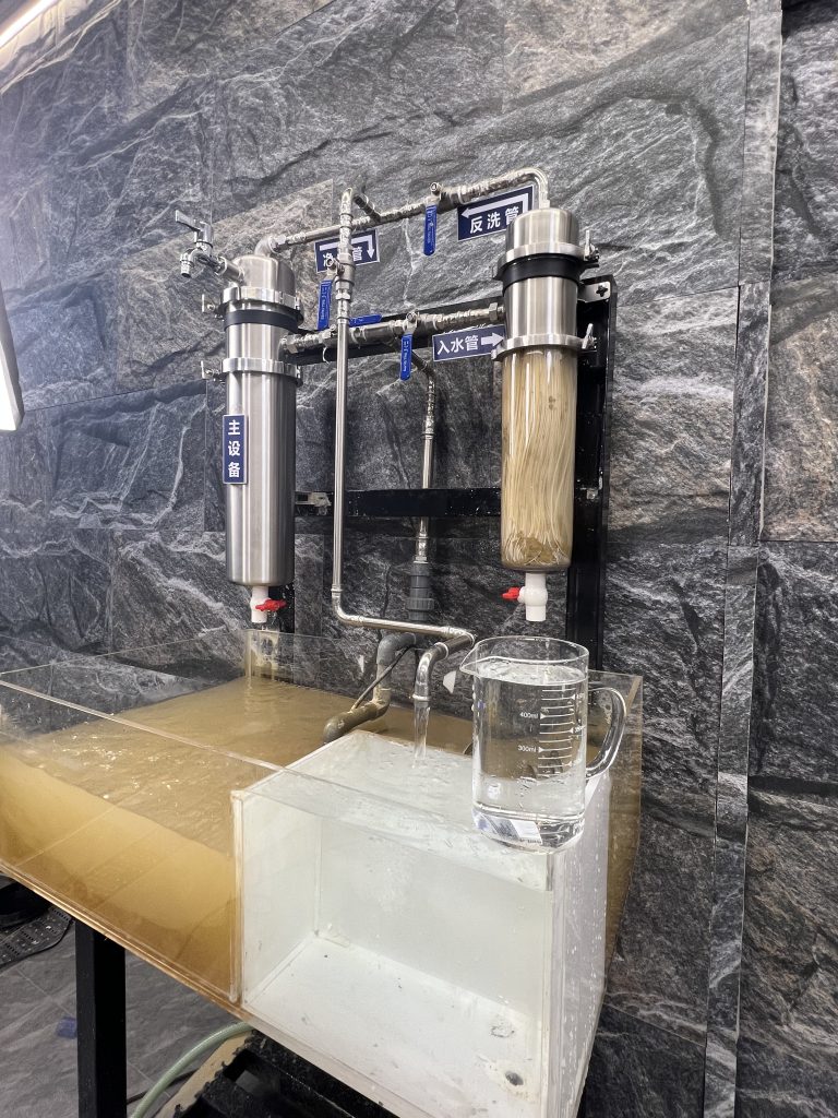 0.1-micron ultrafiltration water filter removing fine sediment from yellow muddy water.