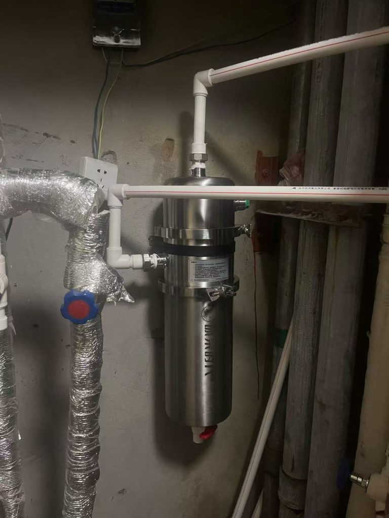 Customer installation of a stainless steel ultrafiltration water filter on the main water inlet pipe for whole house water filtration.