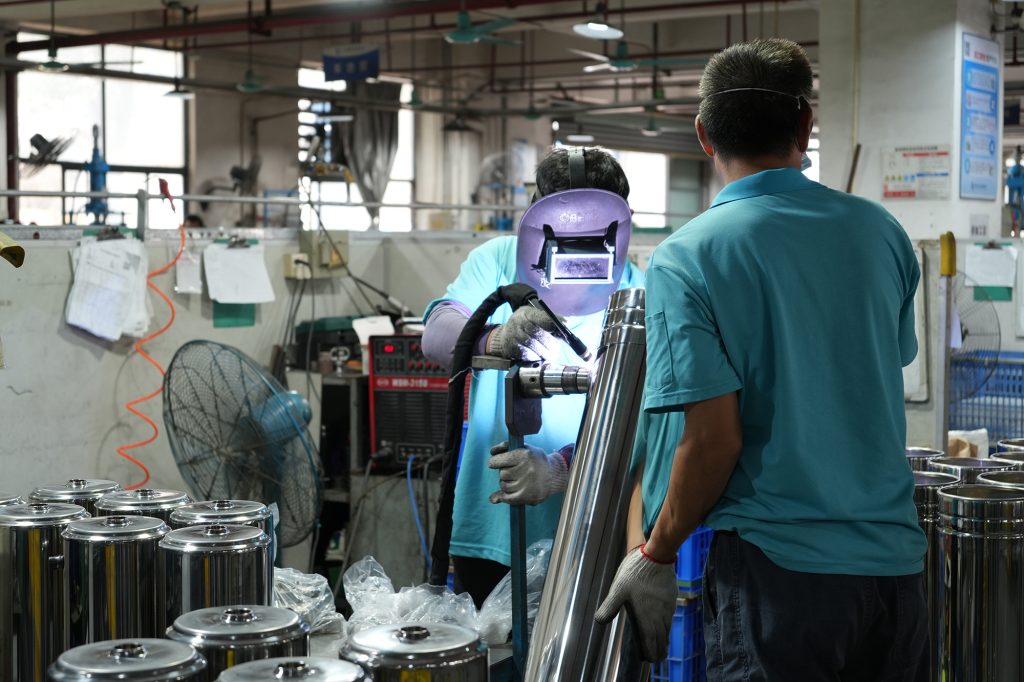Workers at Chengrong Factory perform manual and automated welding processes tailored to different manufacturing conditions.